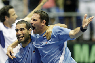 Andy Ram and Yoni Erlich celebrate victory over Russia